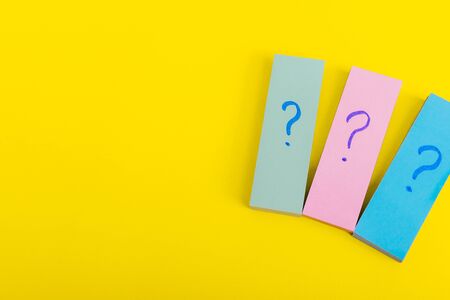 many question mark posters.  written reminders tickets