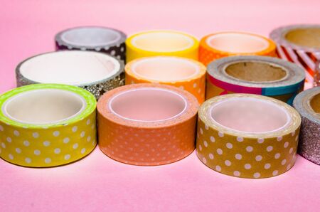 colorful washi tapes isolated on pink background. Feminine stationeryの写真素材