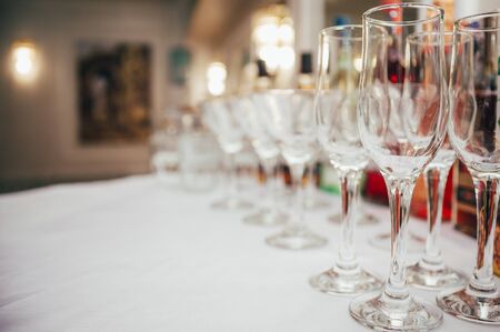 set of empty wineglasses in a lineの写真素材