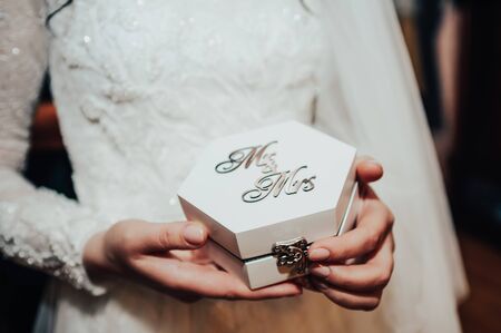 Mr and mrs box for wedding rings in brides handsの写真素材