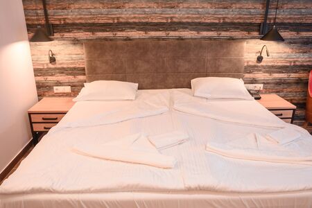 close up view of bed with white pillowcase and sheet