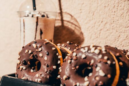 close up view of chocolate donut with frappe. chocolate breakfast concept