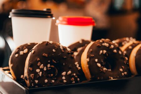 chocolate donuts with takeaway coffee at the coffee shopの写真素材