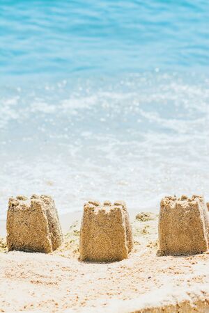 close up view of sand castles on the beachの写真素材