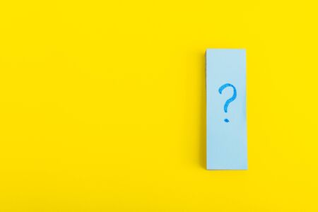 question mark poster.  written reminders tickets isolated on yellow background. dilemma conceptの写真素材