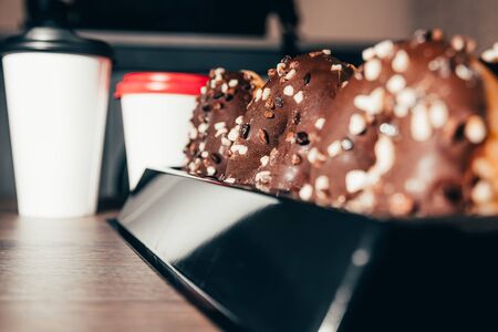 chocolate donuts with takeaway coffee at the coffee shopの写真素材