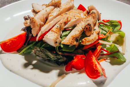 close up of caesar salad with chickenの写真素材