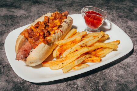 hot dog with vegetarian components and french fries for restaurant menuの写真素材