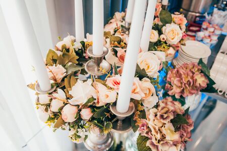 wedding decoration in beautiful restaurant . different candles and flowersの写真素材
