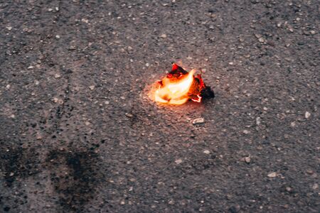 evidence from arson . the piece of burning building