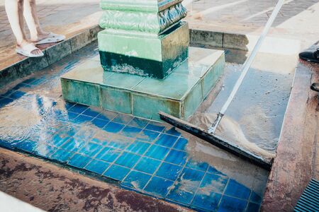 Public washing hands and foot near the sea  clogged with sand and cleaned so that he could work .の写真素材