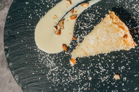 cake with almonds and coconut shvings on top . top view .の写真素材