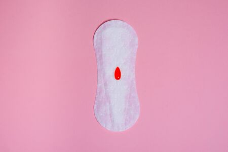 used female menstruation pads on a pink background . women critical days , gynecological menstruation cycle .の写真素材