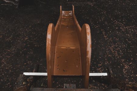 abandoned playground during rain. gloomy place for children .の写真素材