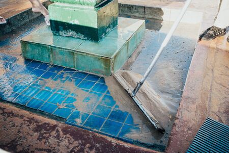 Public washing hands and foot near the sea  clogged with sand and cleaned so that he could work .の写真素材