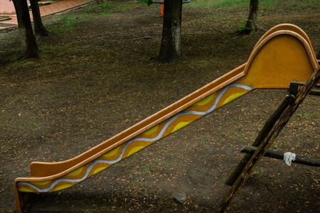 abandoned playground during rain. gloomy place for children .の写真素材