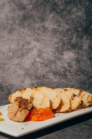 pate with fried slices of bread and jam , restaurant menu .の写真素材