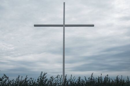 big cross with sea on the background. religion conceptの写真素材