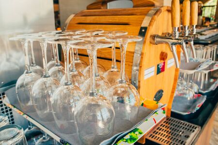 transparent wine glasses drying upside down after washing