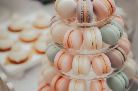 a lot of colorful macaroons at a festive banquet .の写真素材