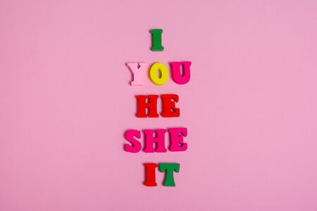 pronouns with colored wooden letters i , you , he, she, it .の写真素材