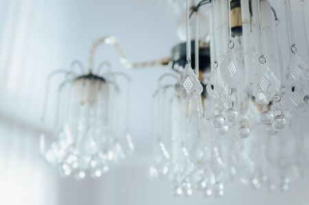 a fly on a glass chandelier in an old house . selective focus close up .の写真素材