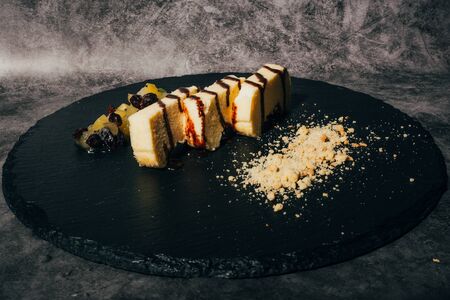 Slices of cheese casserole with chocolate syrup .の写真素材