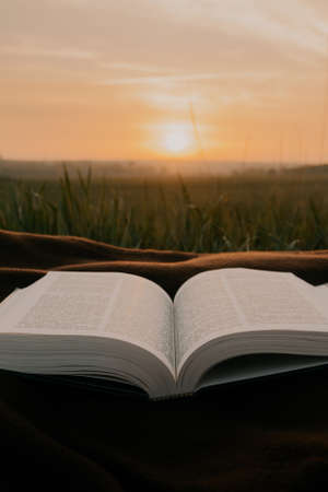 open bible on sheets at sunrise . morning worship .の写真素材