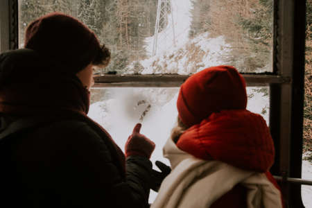 the guy draws on the glass a question mark for the girlの写真素材
