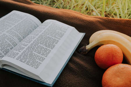 open bible  and fruits  . morning useful food .の写真素材