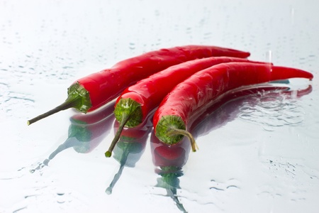 three peppers on the mirrorの写真素材