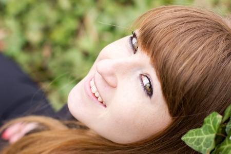 single young beautiful woman relaxing outdoorの写真素材