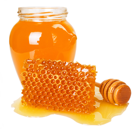 honey with honeycomb isolated on white backgroundの写真素材