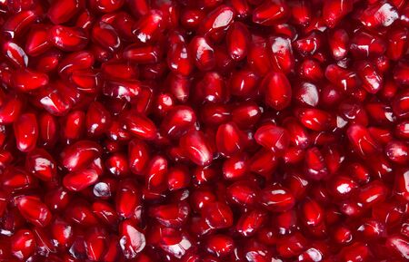fresh pomegranate seeds close-up, backgroundの写真素材