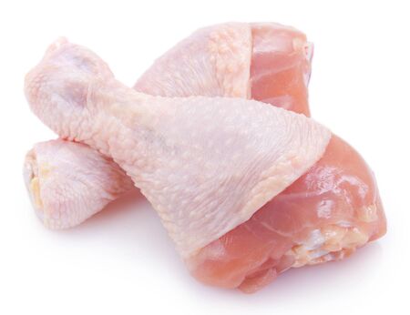 raw chicken legs isolated on white backgroundの写真素材