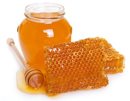 honeycomb with honey isolated on white background closeupの写真素材