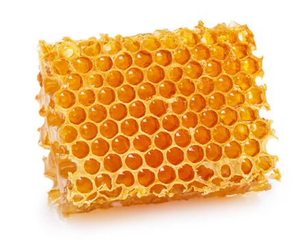 honeycomb with honey isolated on white background closeupの写真素材