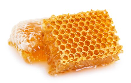 honeycomb with honey isolated on white background closeupの写真素材