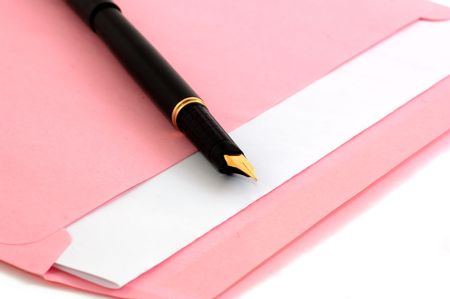 Pink envelope and pen isolated on whiteの写真素材