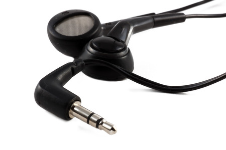 White headphones over a white background.
