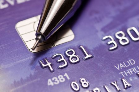 Close-up a pen over credit cardの写真素材