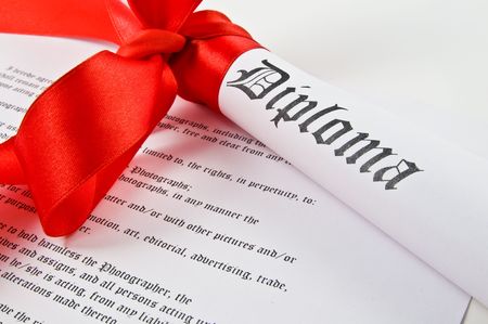 Diploma with red ribbon on white backgroundの写真素材