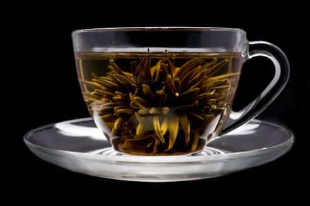 cup with blooming flower green tea の写真素材