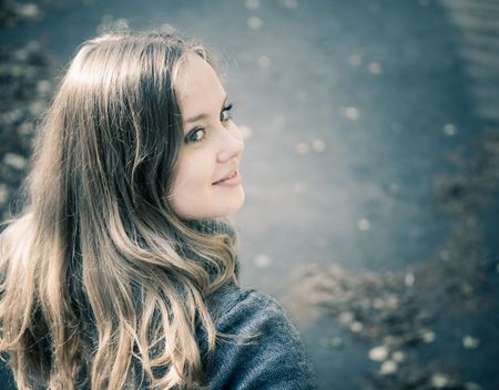 Young woman outdoors portraitの写真素材