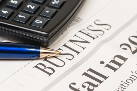 Business concept: calculator, pen 