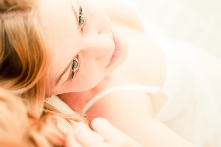 sexy blond woman lay on bed in lingerie の写真素材