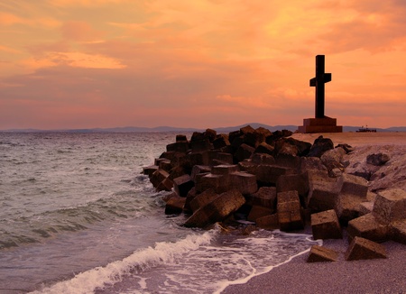 cross at sunset at Pomorie in Bulgariaの写真素材