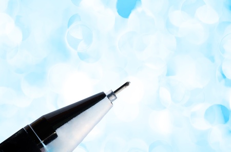 Close-up of a pen on holiday lightsの写真素材