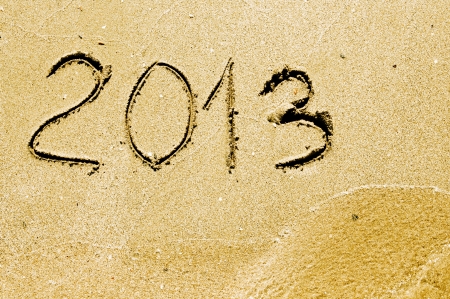 2013 year on the sand beach near the ocean の写真素材