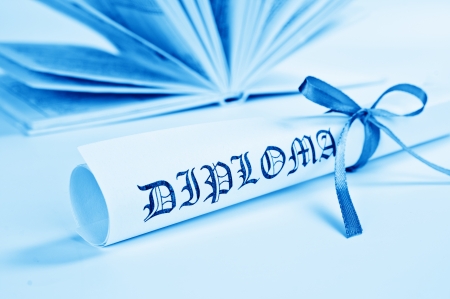 Diploma with blue ribbon and book